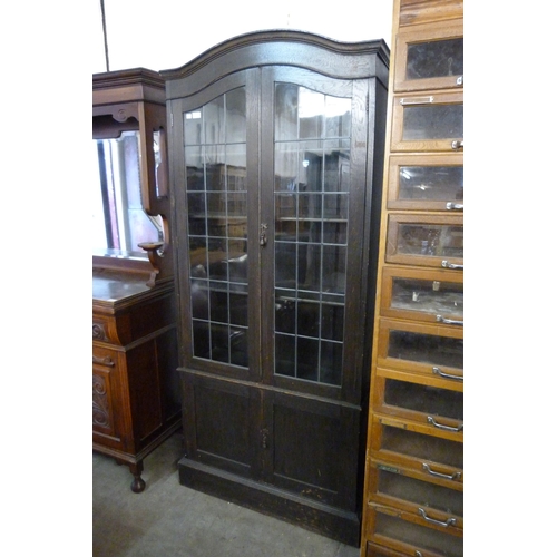 149 - An early 20th Century oak four door bookcase