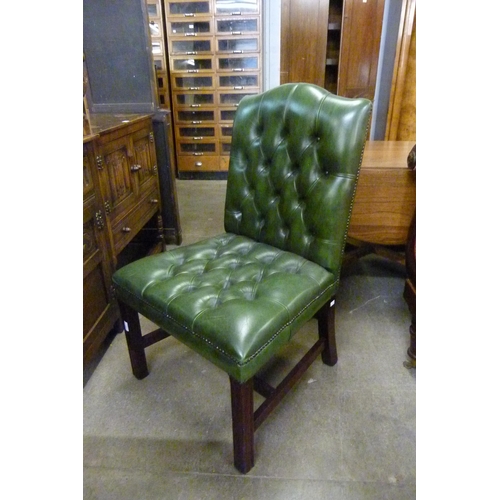 150 - A Regency style mahogany and green leather library chair