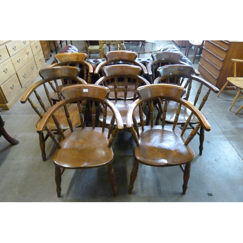 16 - A set of eight early 20th Century elm and beech smokers bow chairs