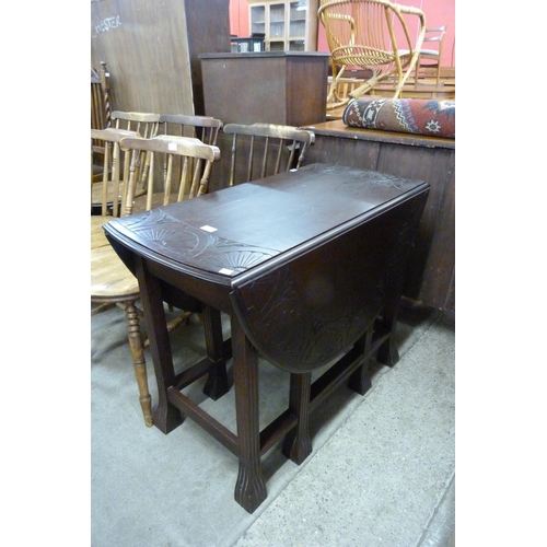 160 - A carved oak gateleg table