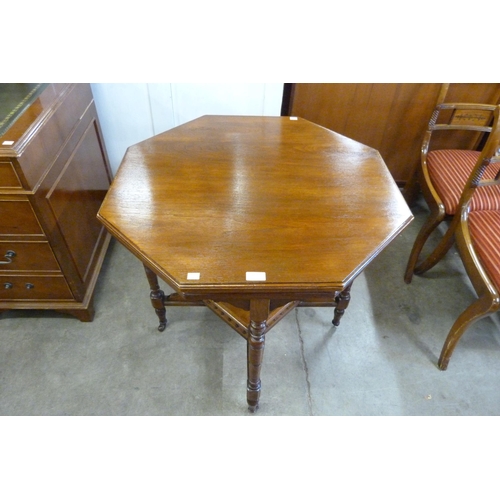 169 - A Victorian walnut octagonal centre table