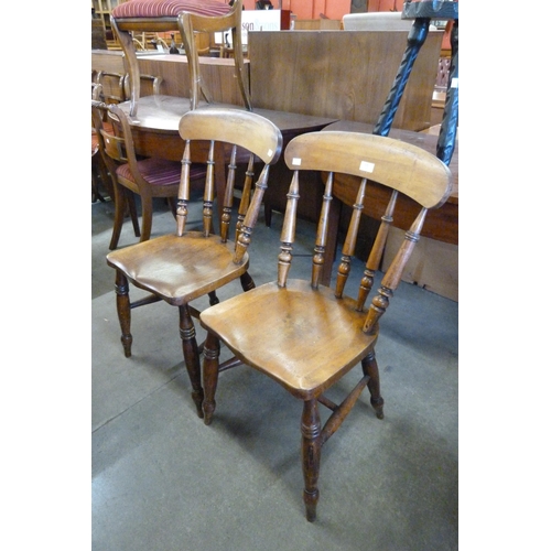 175 - A pair of Victorian beech kitchen chairs