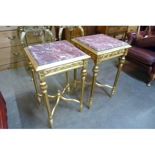 23 - A pair of French Louis XV style giltwood and red marble topped etageres