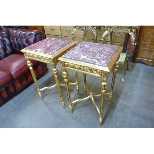 23 - A pair of French Louis XV style giltwood and red marble topped etageres