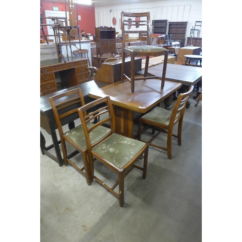 230 - A carved oak six piece dining suite