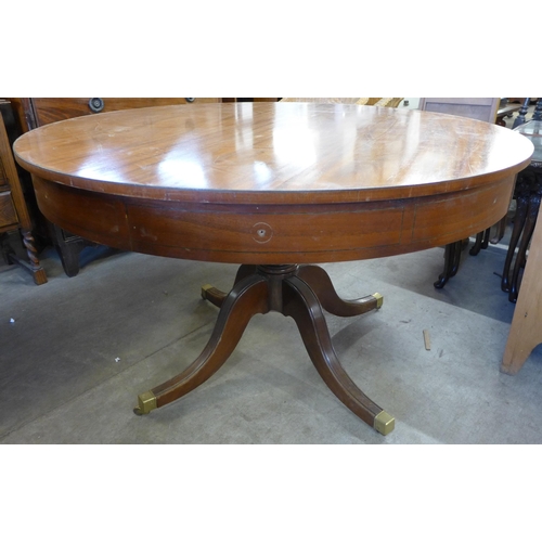 236 - A pair of Regency style mahogany drum shaped library tables