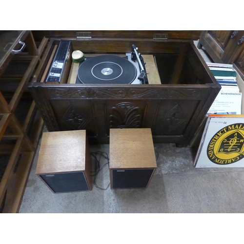 255 - An oak cased Philips turntable, with amplifier and speakers