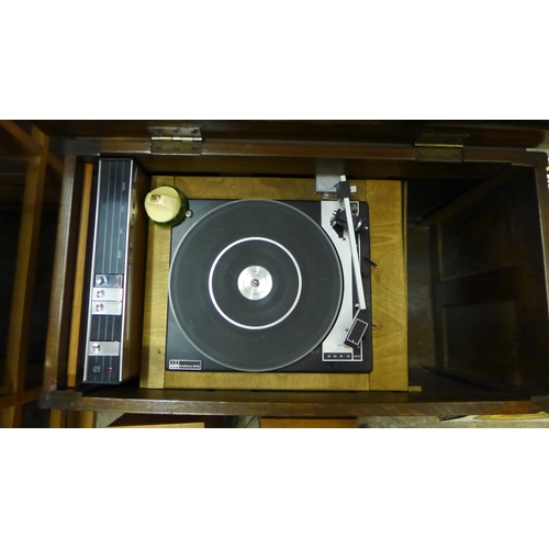 255 - An oak cased Philips turntable, with amplifier and speakers