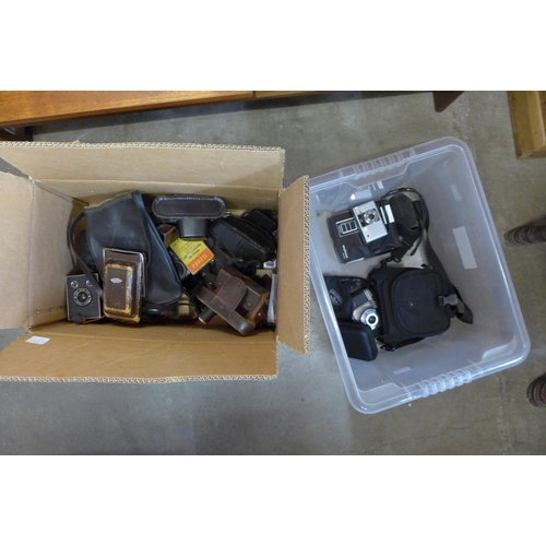 395 - A box of vintage cameras and camera cases, including Voightlander, Zorki, etc