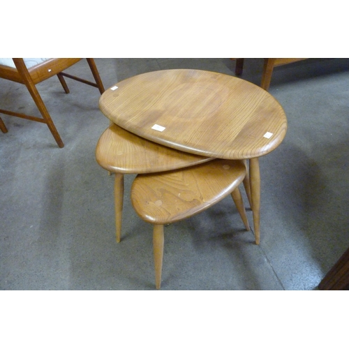 45 - An Ercol Blonde elm and beech pebble shaped nest of tables