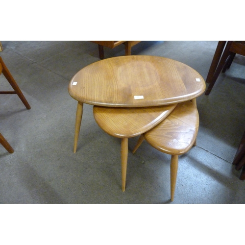 45 - An Ercol Blonde elm and beech pebble shaped nest of tables