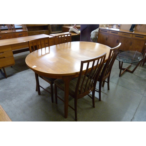 49 - A McIntosh teak extending dining table and four chairs