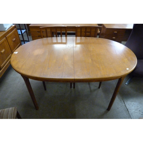 49 - A McIntosh teak extending dining table and four chairs