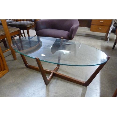 52 - A teak and glass topped oval coffee table