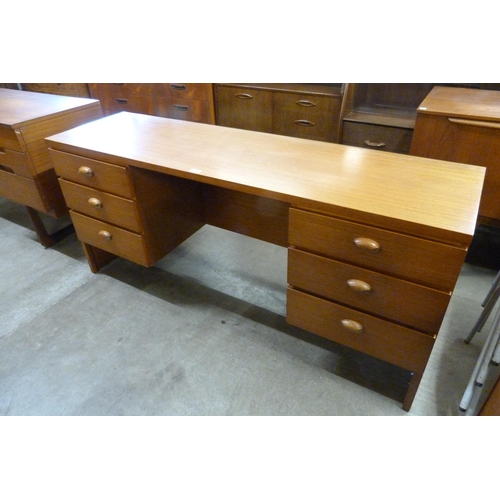 56 - An Austin Suite teak desk