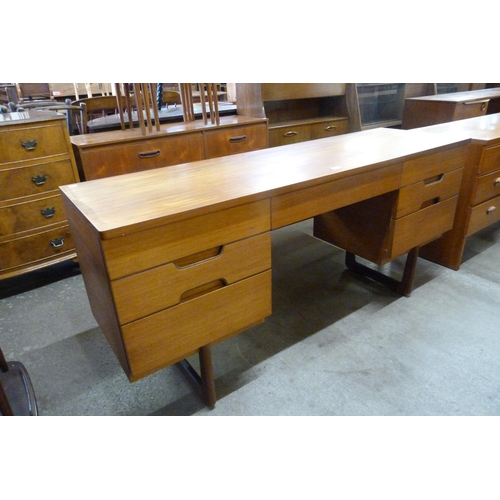 58 - A Uniflex teak desk