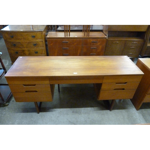 58 - A Uniflex teak desk