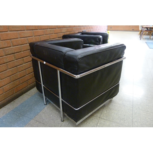 63A - A pair of Bauhaus style black leather and chrome LC2 model armchairs, after Le Corbusier