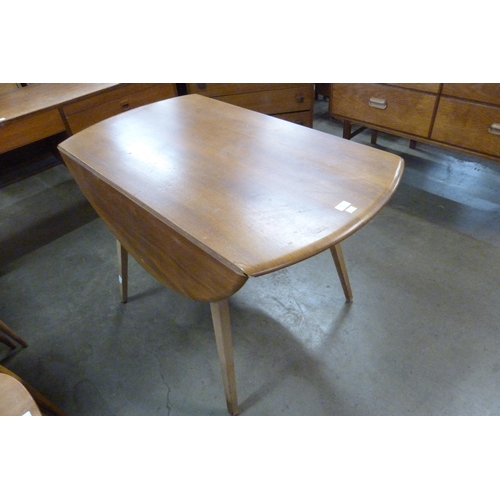 65 - An Ercol Blonde elm and beech Windsor drop leaf table