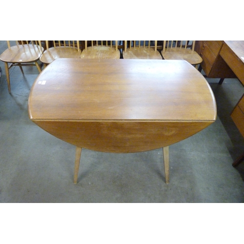 65 - An Ercol Blonde elm and beech Windsor drop leaf table