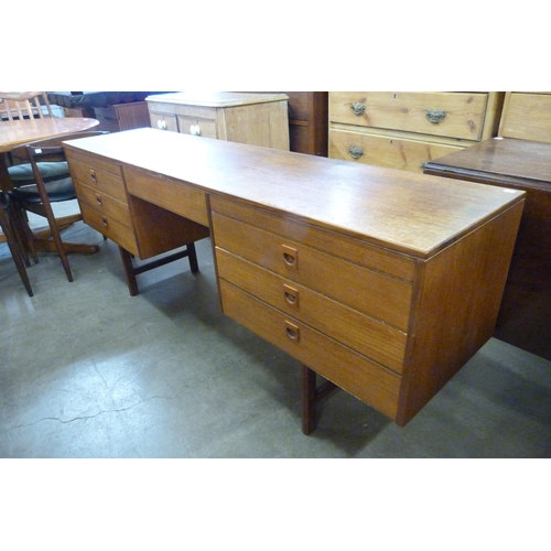 74 - An Alfred Cox teak desk