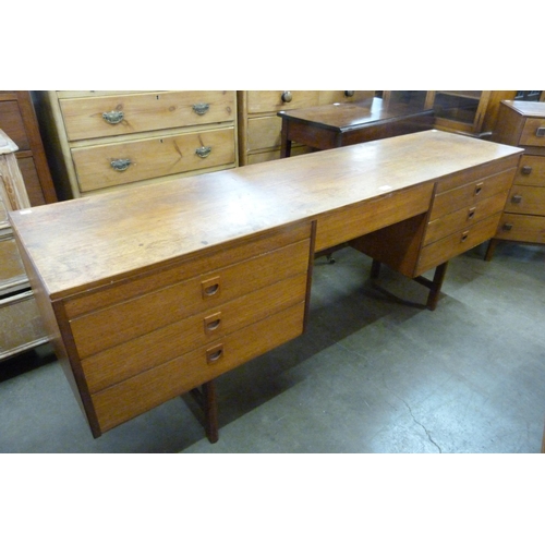 74 - An Alfred Cox teak desk