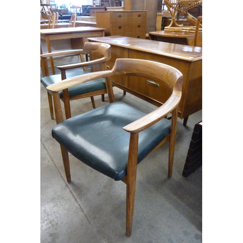 81 - A pair of Danish teak elbow chairs