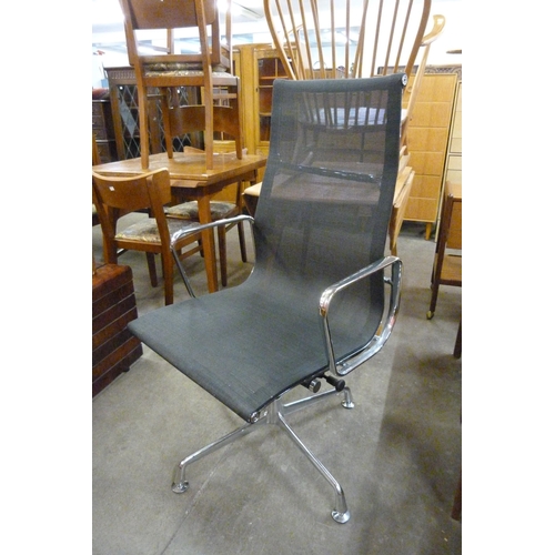 86 - An Eames style chrome revolving desk chair