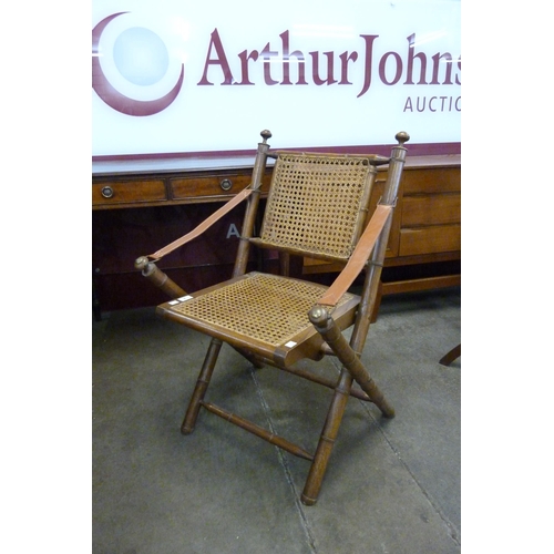 9 - A Victorian campaign style faux bamboo and bergere folding chair