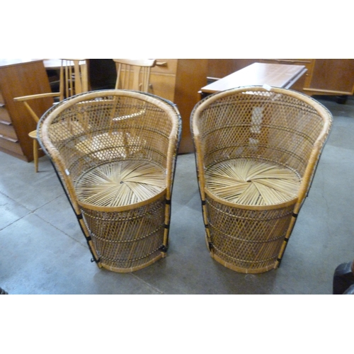 90 - A pair of Italian wicker peacock chairs