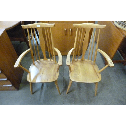 91 - A pair of Ercol style Blonde elm and beech chairs