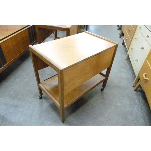 99 - A teak two tier drop leaf cocktail trolley