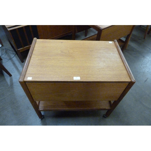 99 - A teak two tier drop leaf cocktail trolley