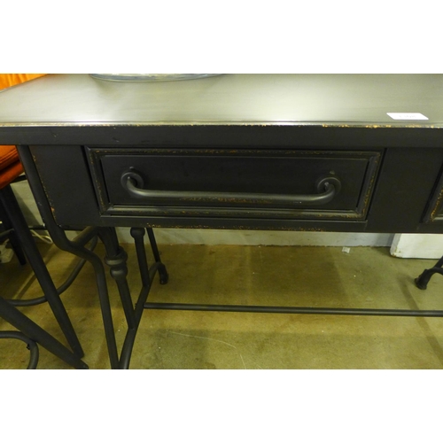 1308 - A black metal two drawer desk - slightly marked