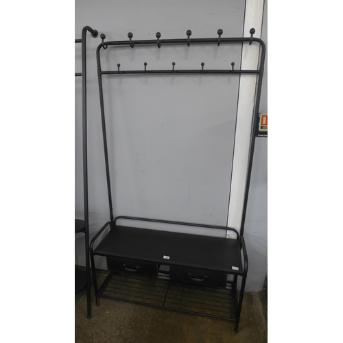 1404 - A black metal tubular hall stand