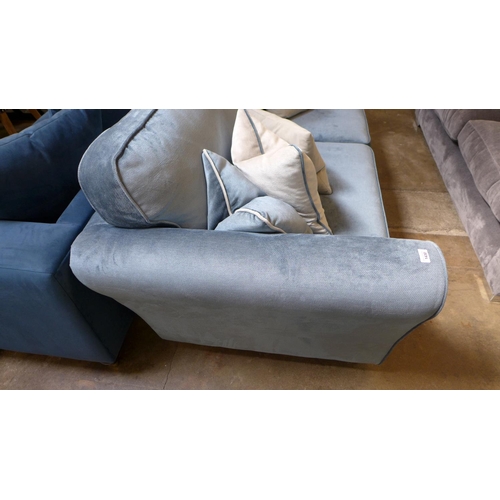 1430 - A diamond blue upholstered four seater sofa