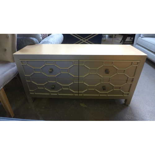 1496 - A gold four drawer sideboard