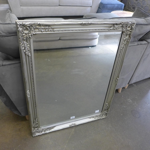 1525 - An antique style silver framed mirror