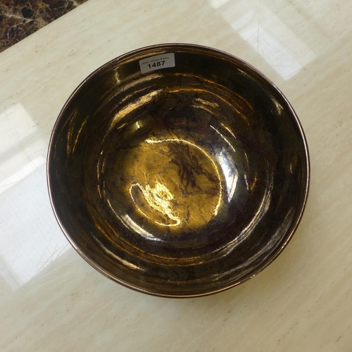 1487 - An art deco style golden fruit bowl