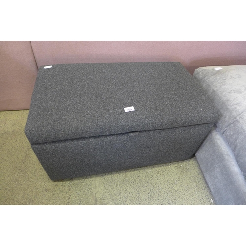 1567 - A static black fabric ottoman footstool