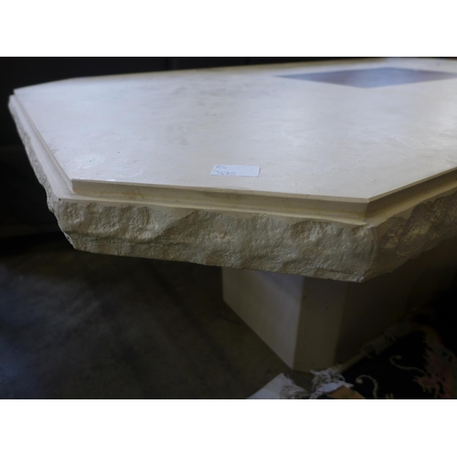 1596 - A cream stone dining table