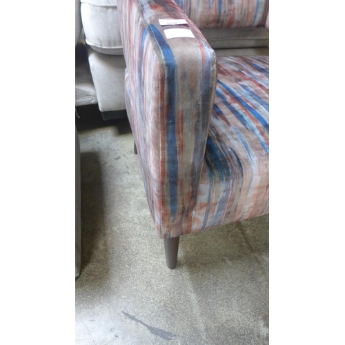 1603 - A red, blue and grey distressed upholstered armchair