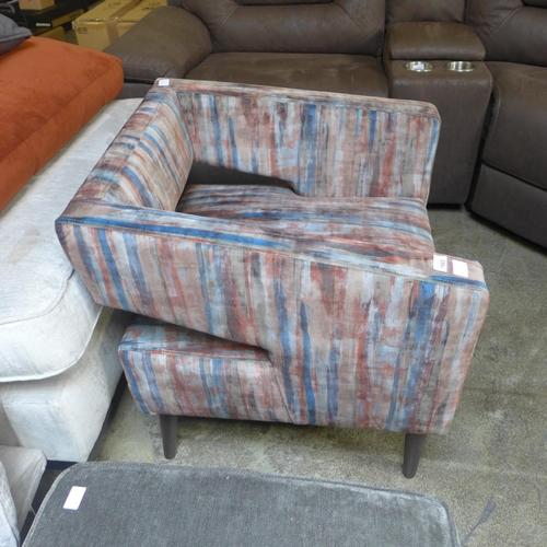 1603 - A red, blue and grey distressed upholstered armchair