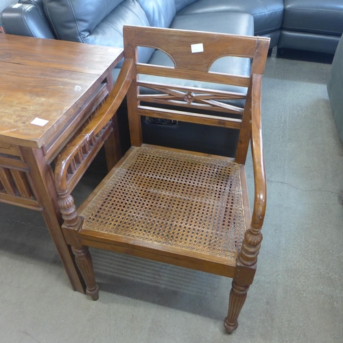 1613 - An oak four drawer hardwood desk and matching chair