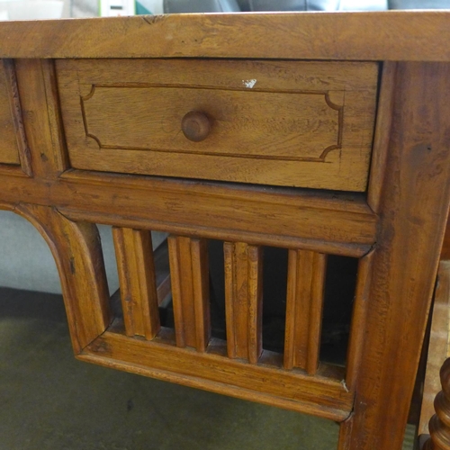 1613 - An oak four drawer hardwood desk and matching chair