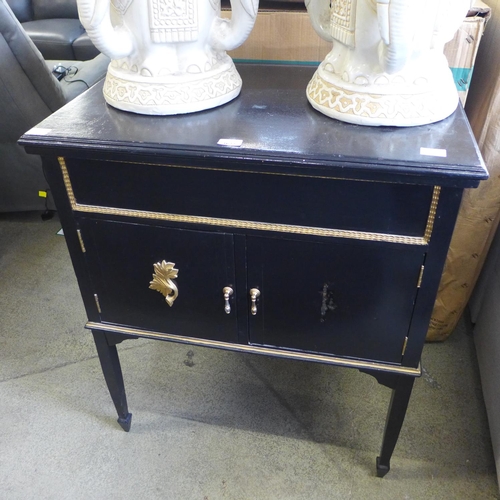 1622 - A black and gold painted two door hall table