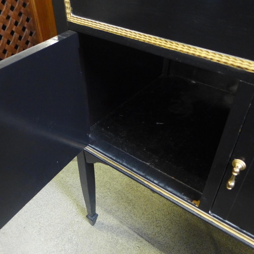 1622 - A black and gold painted two door hall table