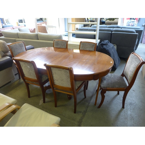 1632 - A cherry wood oval extending dining table with a set of six grey upholstered dining chairs