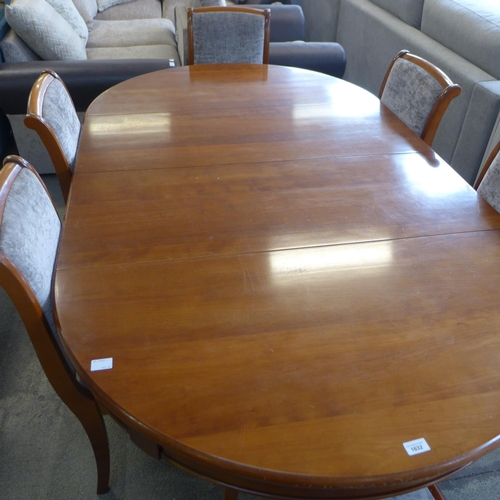 1632 - A cherry wood oval extending dining table with a set of six grey upholstered dining chairs