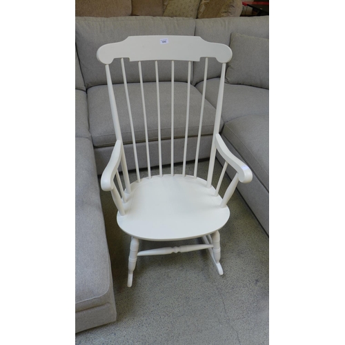 1642 - A white painted spoke back rocking chair